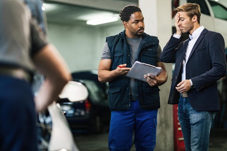 Mechanic talking to customer