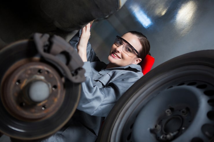 Mechanic holding brake pads