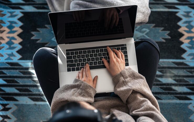 Person typing on modern laptop