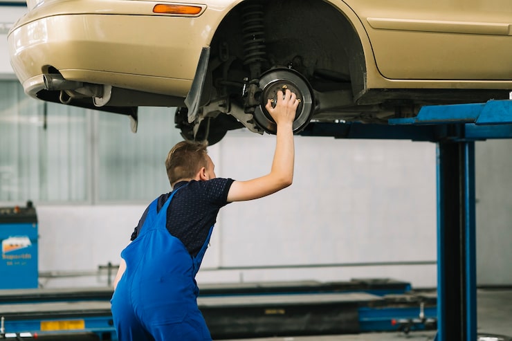 Car undercarriage on a hoist